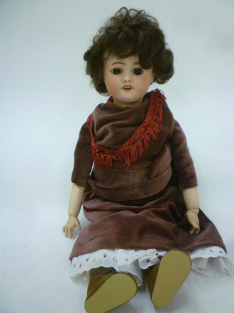 An S.F.B.J. bisque head doll with fixed brown glass eyes Image