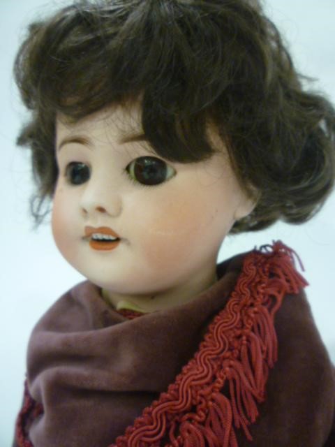 An S.F.B.J. bisque head doll with fixed brown glass eyes Image
