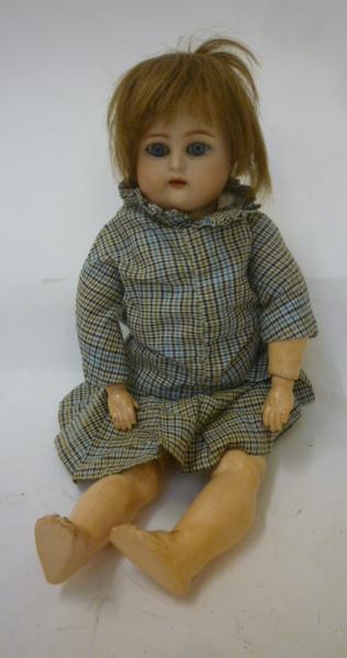 A Kammer & Reinhardt bisque head doll with blue glass sleeping eyes Image