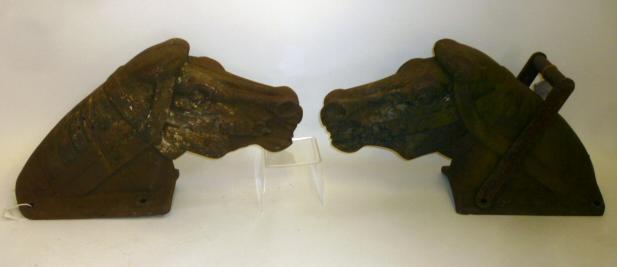 Two similar cast iron horse's heads for playground rockers Image