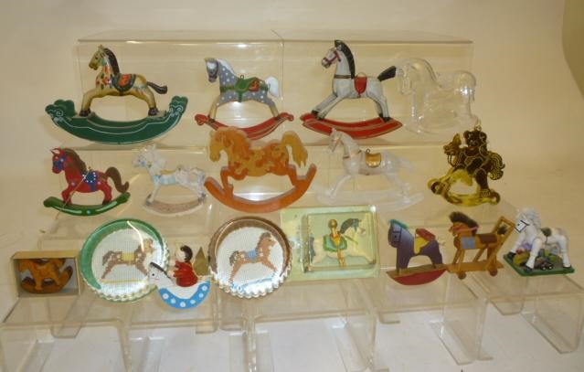 A collection of miniature rocking horses and horse figures comprising four painted and/or carved Image