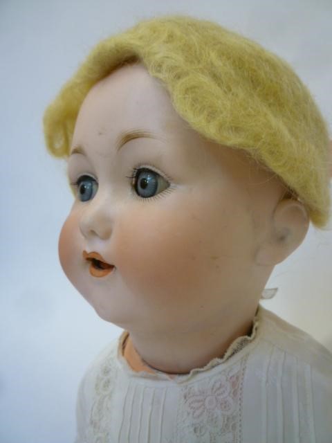 An Otto Gans bisque head character doll with blue glass sleeping eyes Image