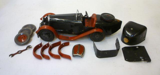 A Meccano constructor sports car in black with red wings and seat Image
