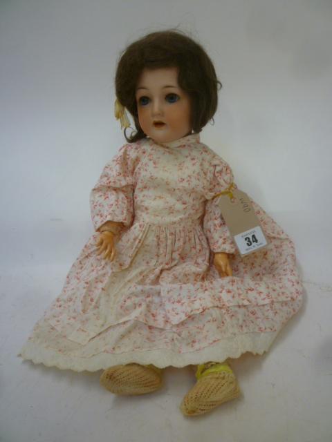 A Gebruder Ohlhaver "Revalo" bisque head doll with blue glass sleeping eyes Image