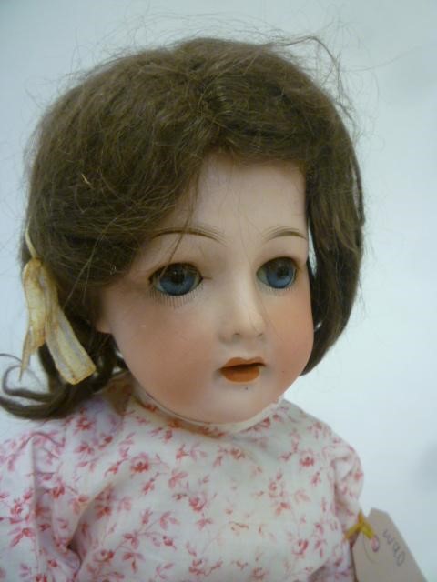 A Gebruder Ohlhaver "Revalo" bisque head doll with blue glass sleeping eyes Image