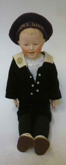 A Gebruder Heubach laughing boy doll with bisque shoulder head intaglio eyes Image