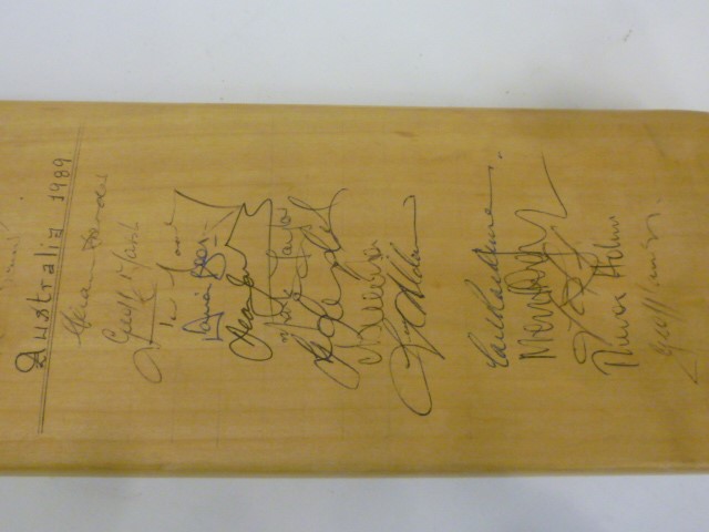 A Duncan Fearnley cricket bat autographed by the 1989 test cricket squads for England and Australia Image