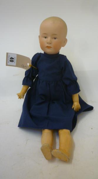 A Gebruder Heubach bisque head "Solemn Boy" doll with painted mouth Image