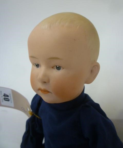 A Gebruder Heubach bisque head "Solemn Boy" doll with painted mouth Image