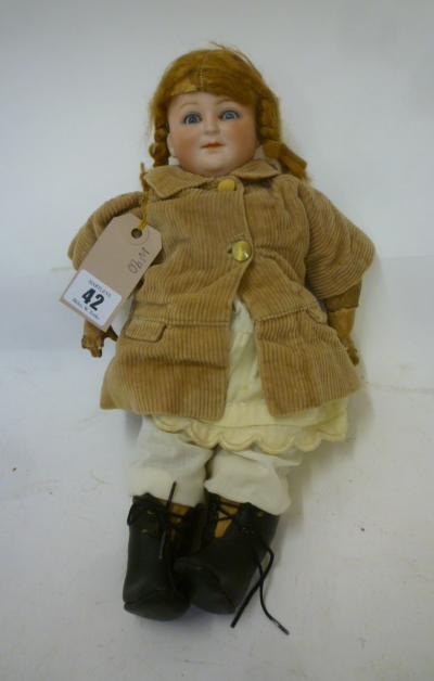 A German bisque head character doll with blue glass sleeping eyes Image