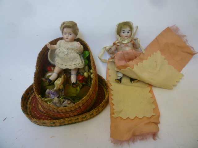 An all bisque dolls house doll with blue glass eyes Image