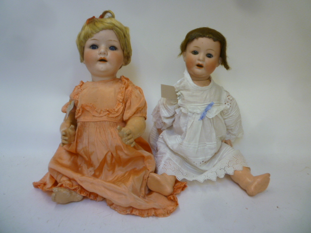 An Ernst Heubach bisque head character doll with blue glass sleeping eyes Image