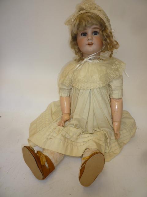 A Tete Jumeau DEP bisque head doll with blue glass sleeping eyes Image
