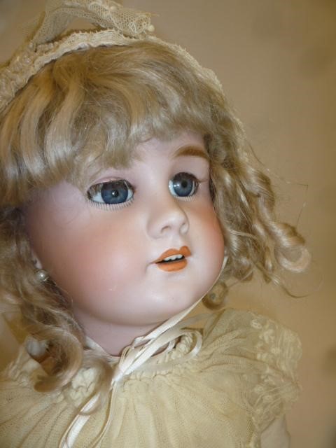 A Tete Jumeau DEP bisque head doll with blue glass sleeping eyes Image