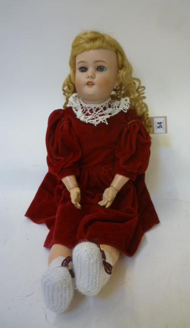A Simon & Halbig bisque head doll with blue glass sleeping eyes Image