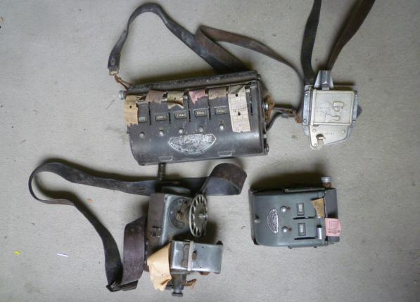 Three various bus conductors ticket machines Image