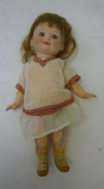 An Armand Marseille bisque head google eyed character doll with blue glass sleeping eyes Image