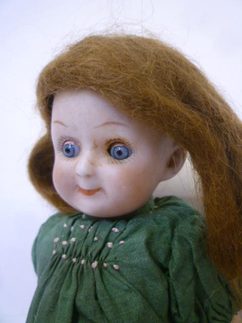 A Gebruder Heubach google eyed bisque head doll Image