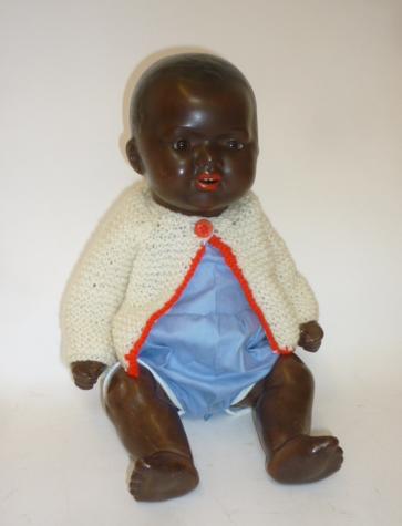 An armand marseille bisque head black baby doll with brown glass sleeping eyes Hartleys Auctioneers Valuers