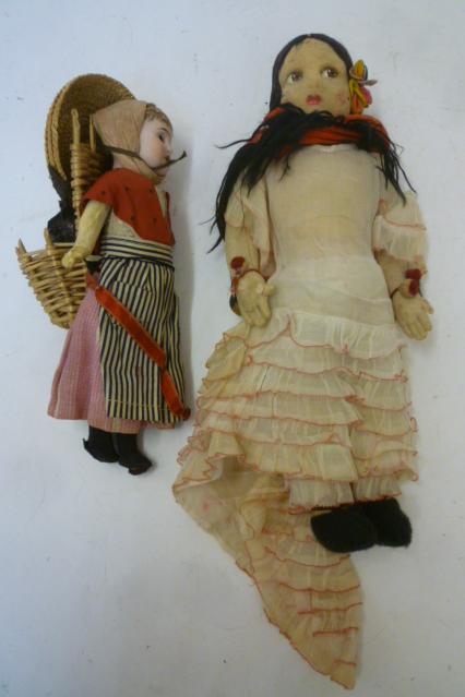 A German bisque head doll with fixed brown glass eyes Image