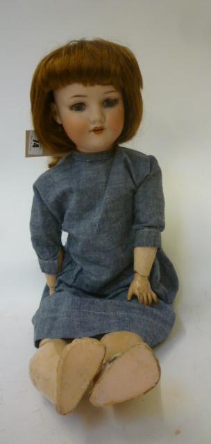 An Armand Marseille bisque head doll with blue glass sleeping eyes Image