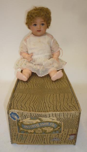 A Kammer & Reinhardt celluloid head character doll with blue glass flirty eyes Image