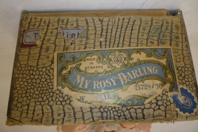 A Kammer & Reinhardt celluloid head character doll with blue glass flirty eyes Image