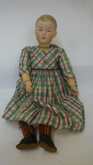 A Hertel Schwab & Co bisque head doll with painted face and hair Image