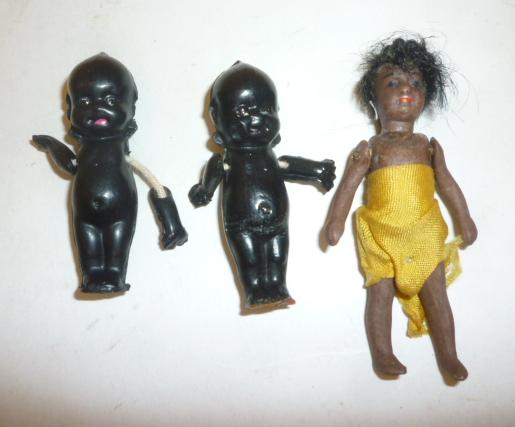 An all bisque Mulatto doll's house doll with black mohair wig Image