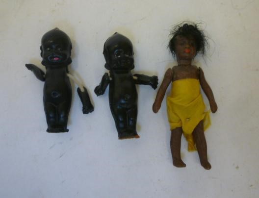 An all bisque Mulatto doll's house doll with black mohair wig Image