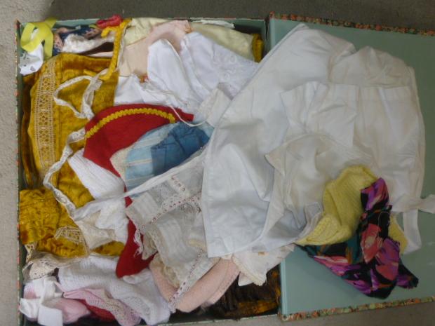 A large quantity of dolls clothing in cotton Image