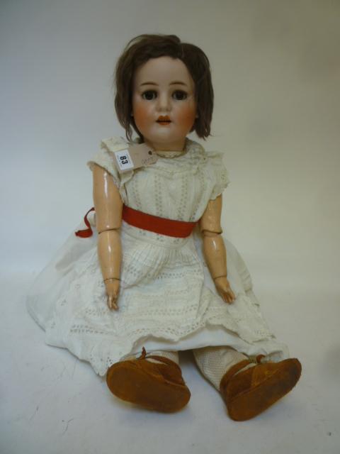 A Max Handwercke "Bebe Elite" bisque head girl doll with brown glass sleeping eyes Image
