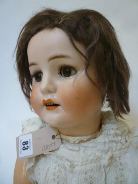 A Max Handwercke "Bebe Elite" bisque head girl doll with brown glass sleeping eyes Image