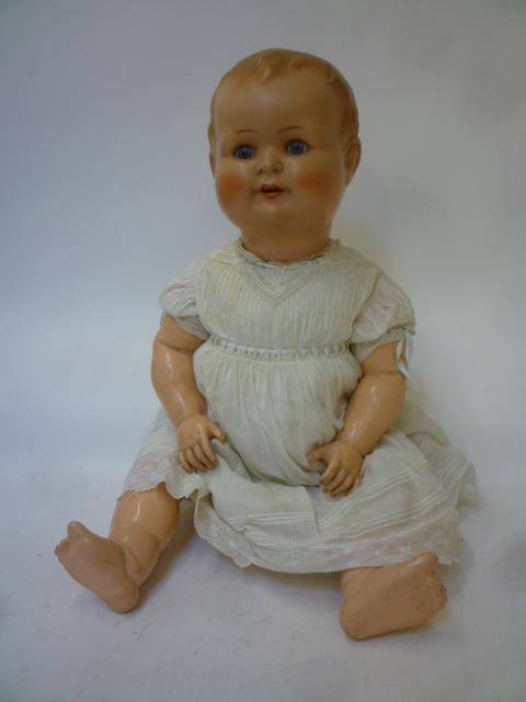 A German all bisque doll with blue glass sleeping eyes Image