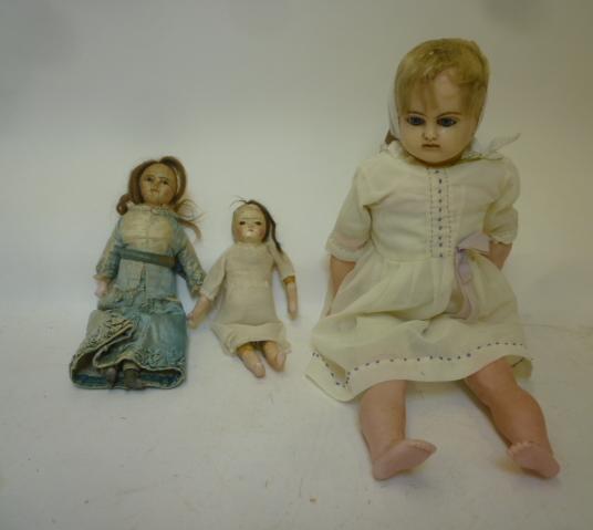 A wax covered shoulder head doll with blue glass sleeping eyes Image