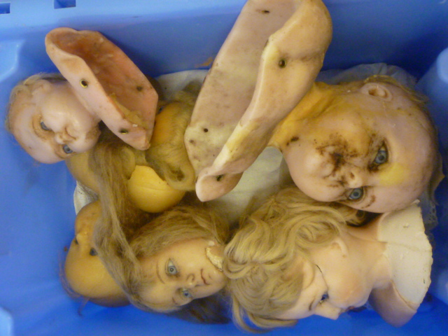 A quantity of dolls spare parts Image