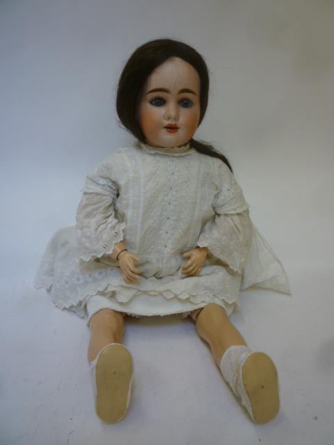 A Pierre Muller (French) bisque head doll with blue glass sleeping eyes Image