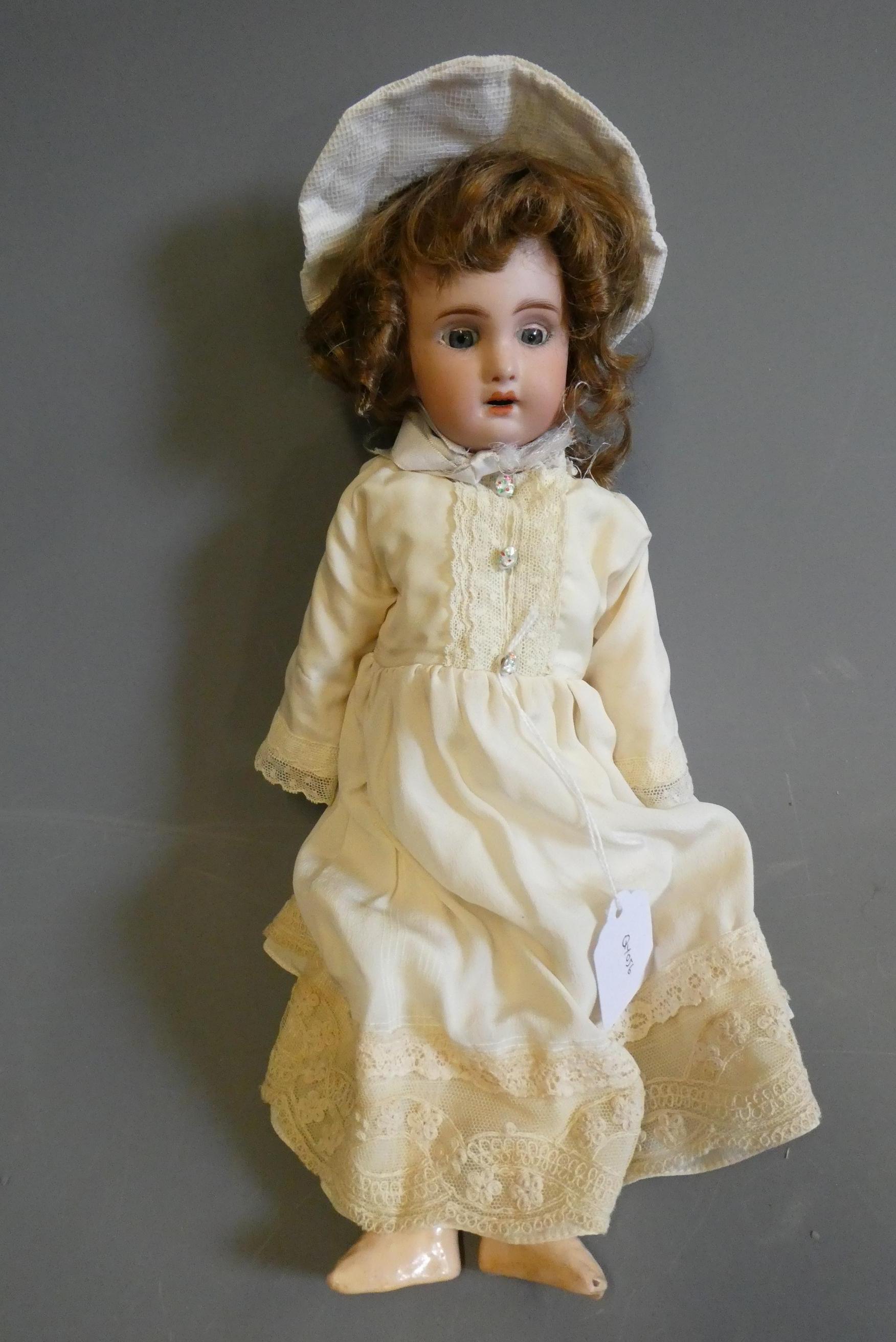 A French bisque socket head doll, with blue glass sleeping eyes, open mouth, teeth, pierced ears, Image