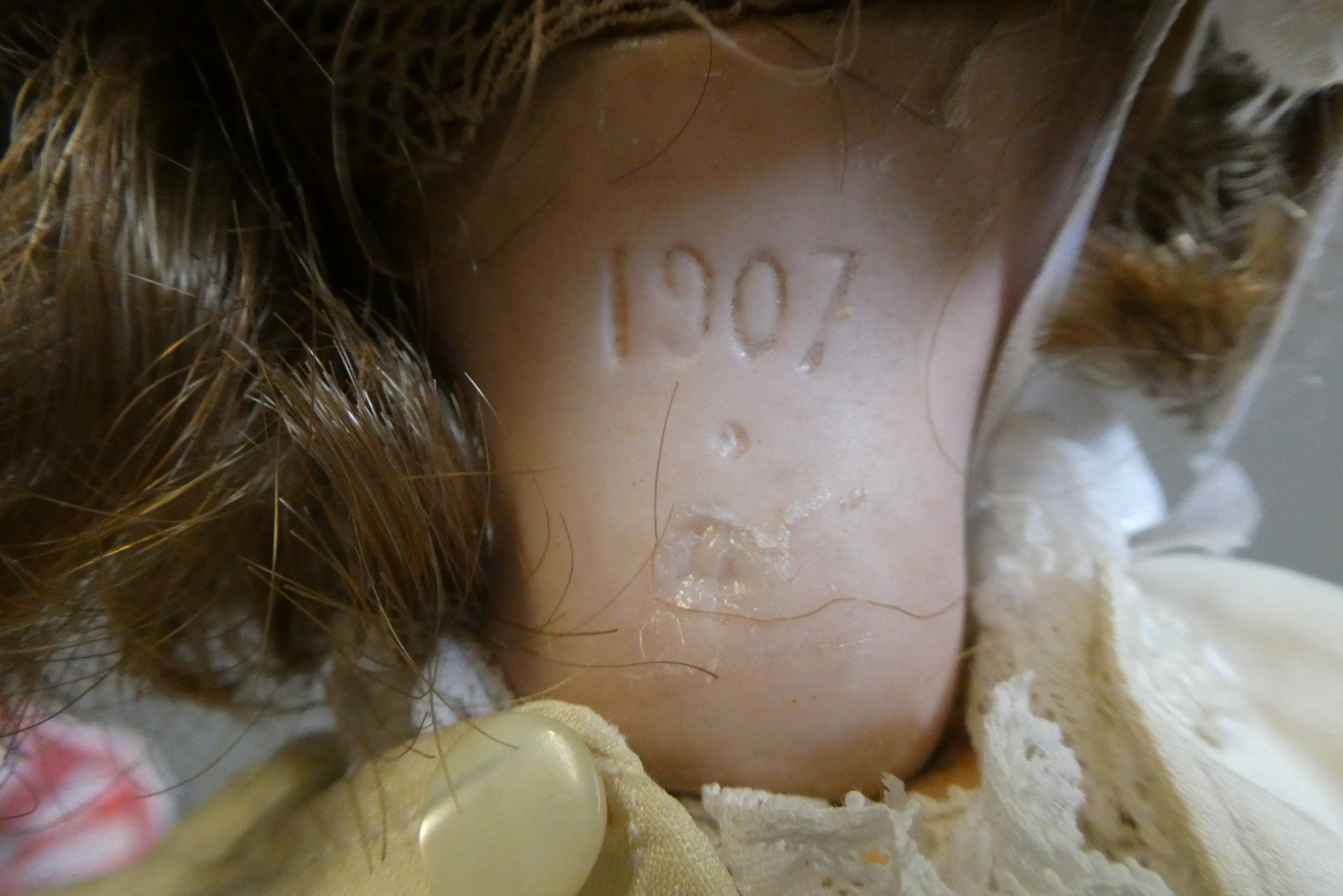 A French bisque socket head doll, with blue glass sleeping eyes, open mouth, teeth, pierced ears, Image