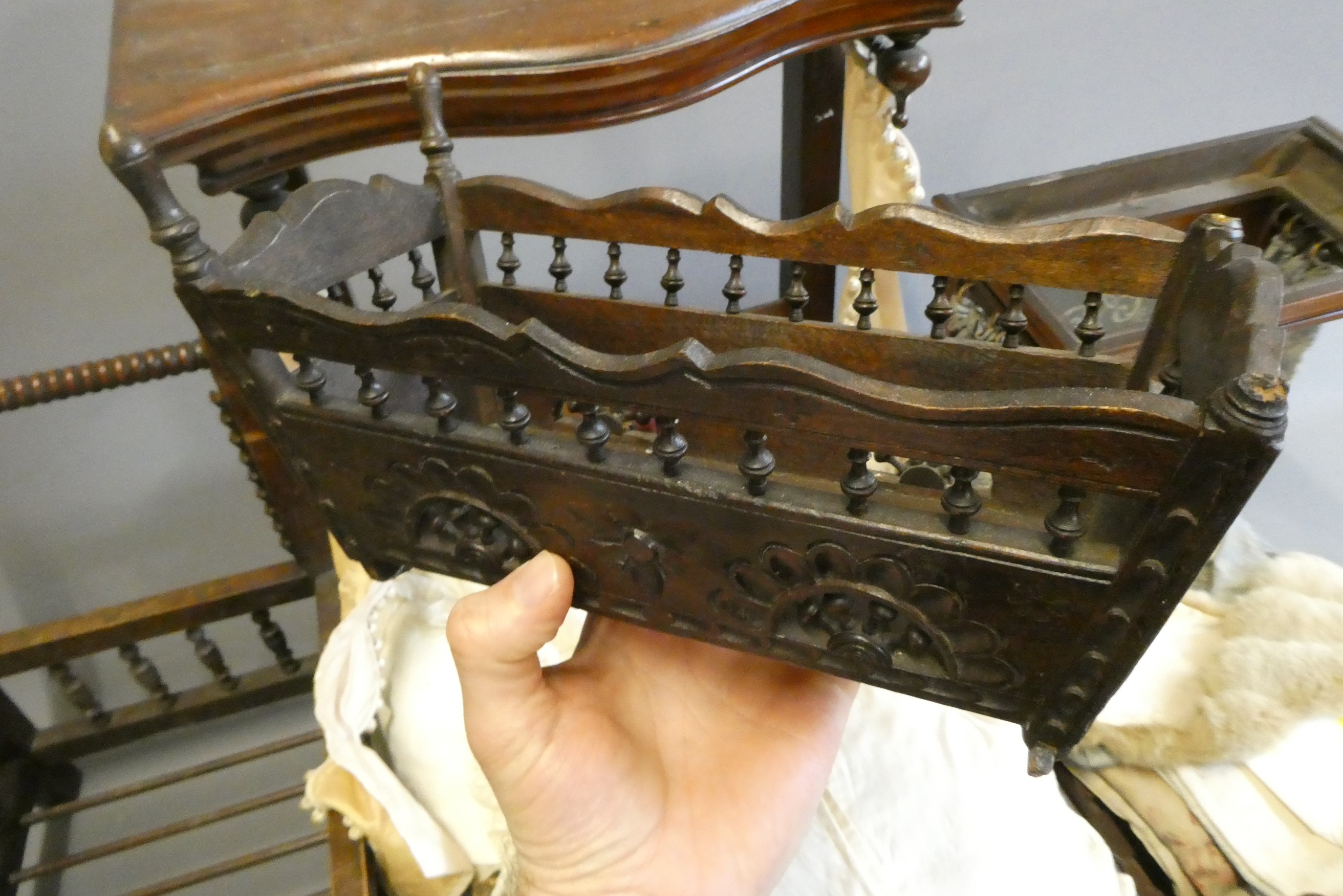 Three antique doll's beds, all of wood construction, comprising two half testers and one with turned Image