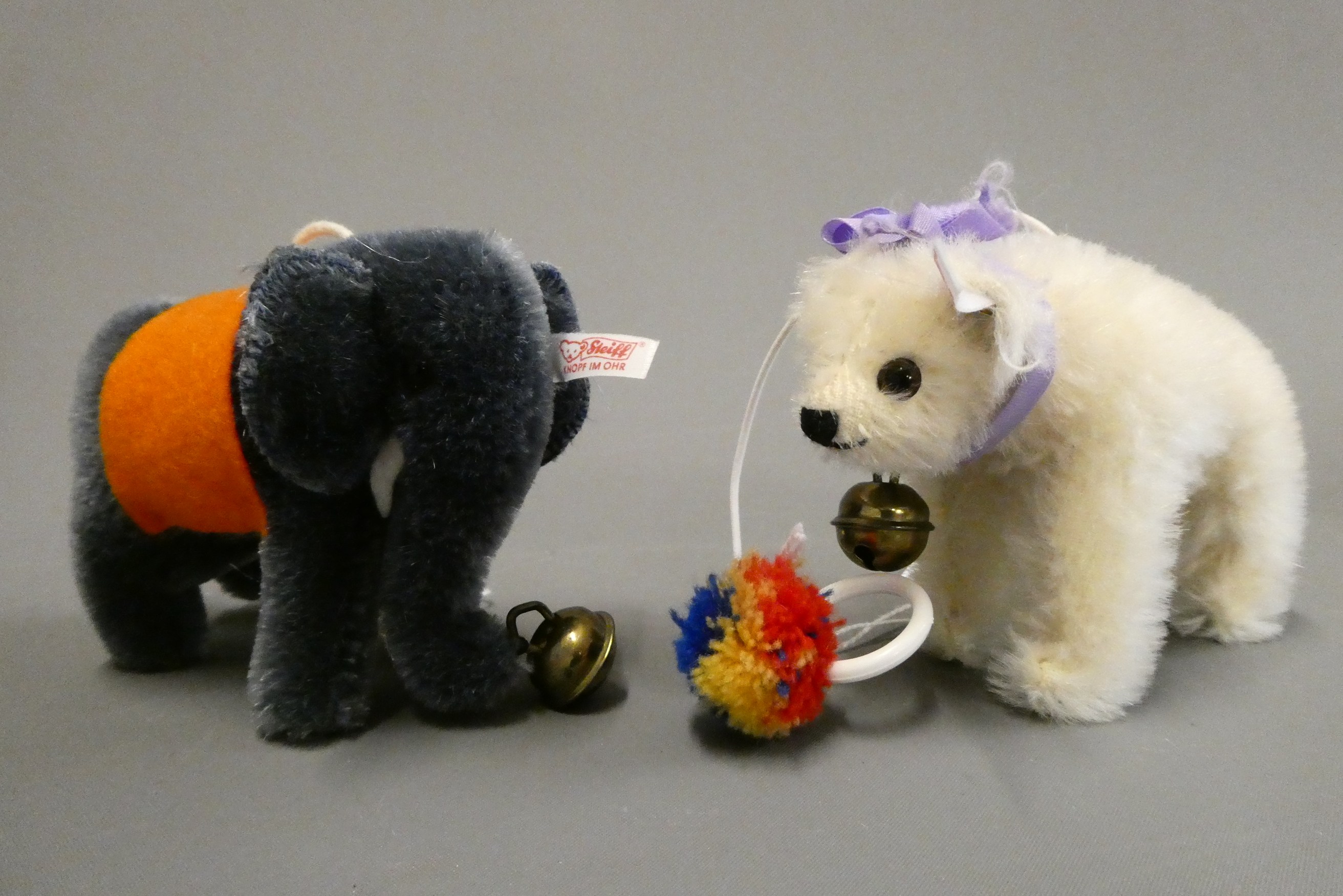 Two Steiff miniature animals, comprising a white bear on all fours and an Elephant, both with bells Image