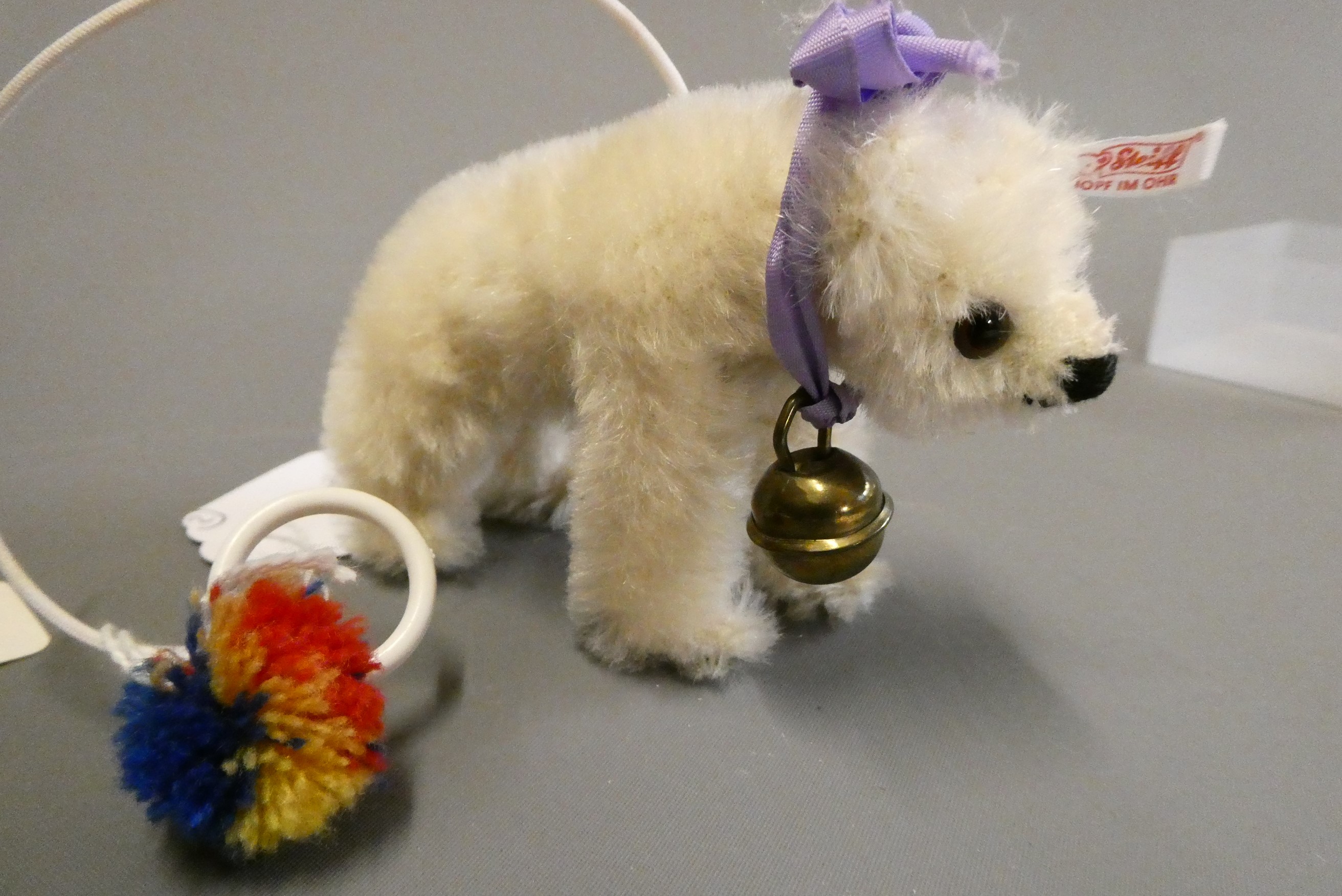 Two Steiff miniature animals, comprising a white bear on all fours and an Elephant, both with bells Image