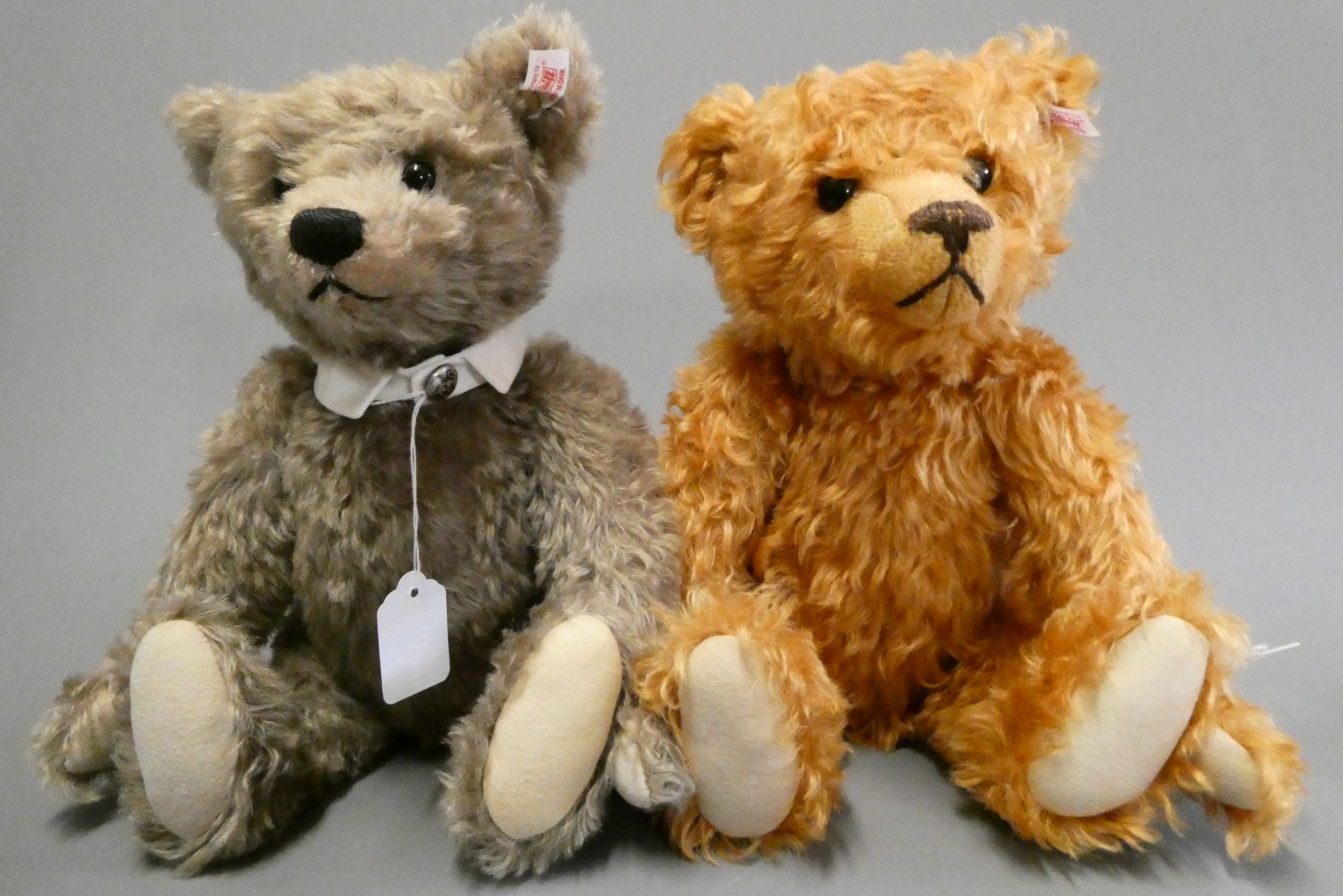 Two Steiff collector's growling teddy bears, comprising a 15 1/2" auburn bear, and a 15" grey bear Image