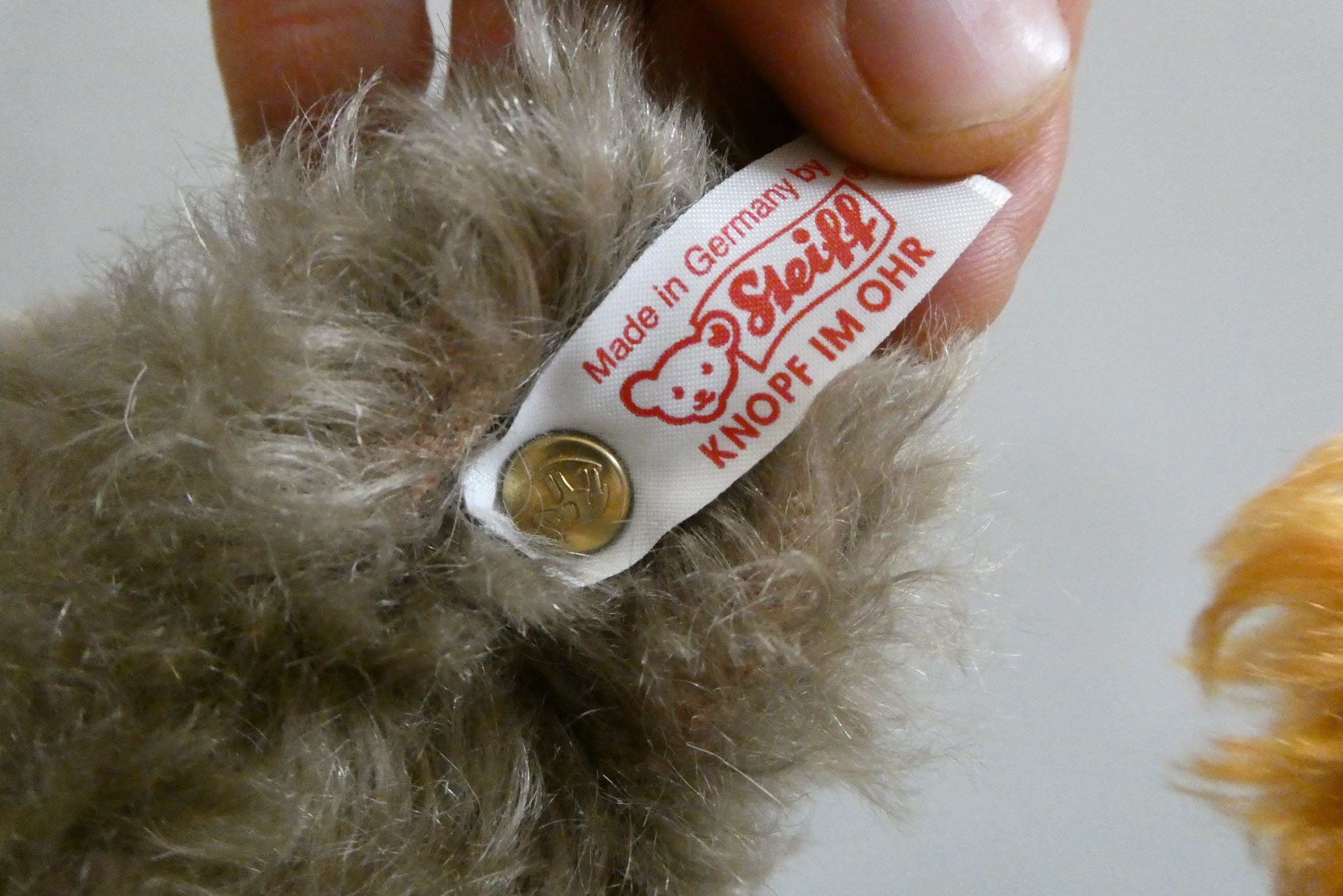 Two Steiff collector's growling teddy bears, comprising a 15 1/2" auburn bear, and a 15" grey bear Image