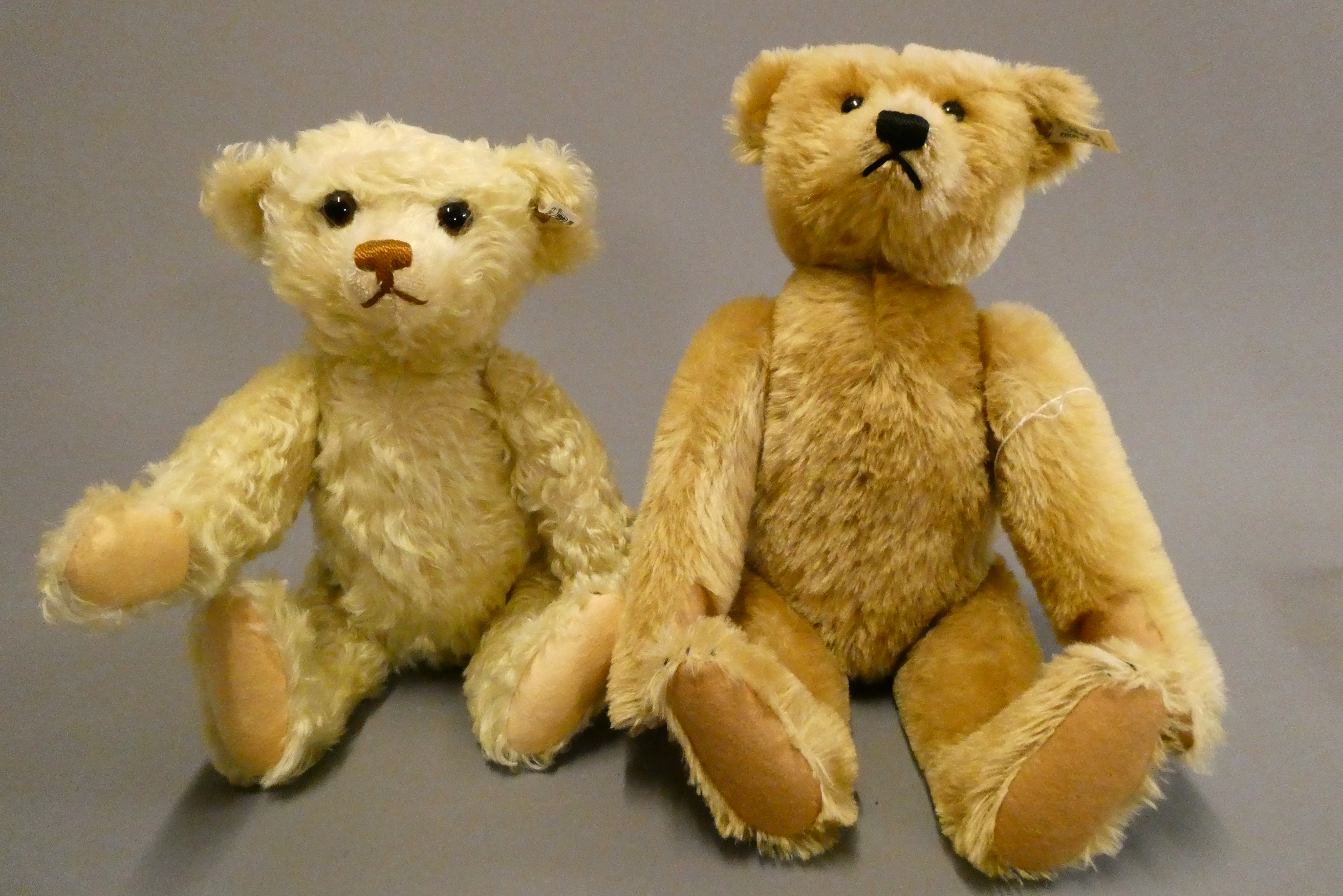 Two Steiff collector's teddy bears, comprising a 16 1/2" bear with orange plush and a 15" bear with Image