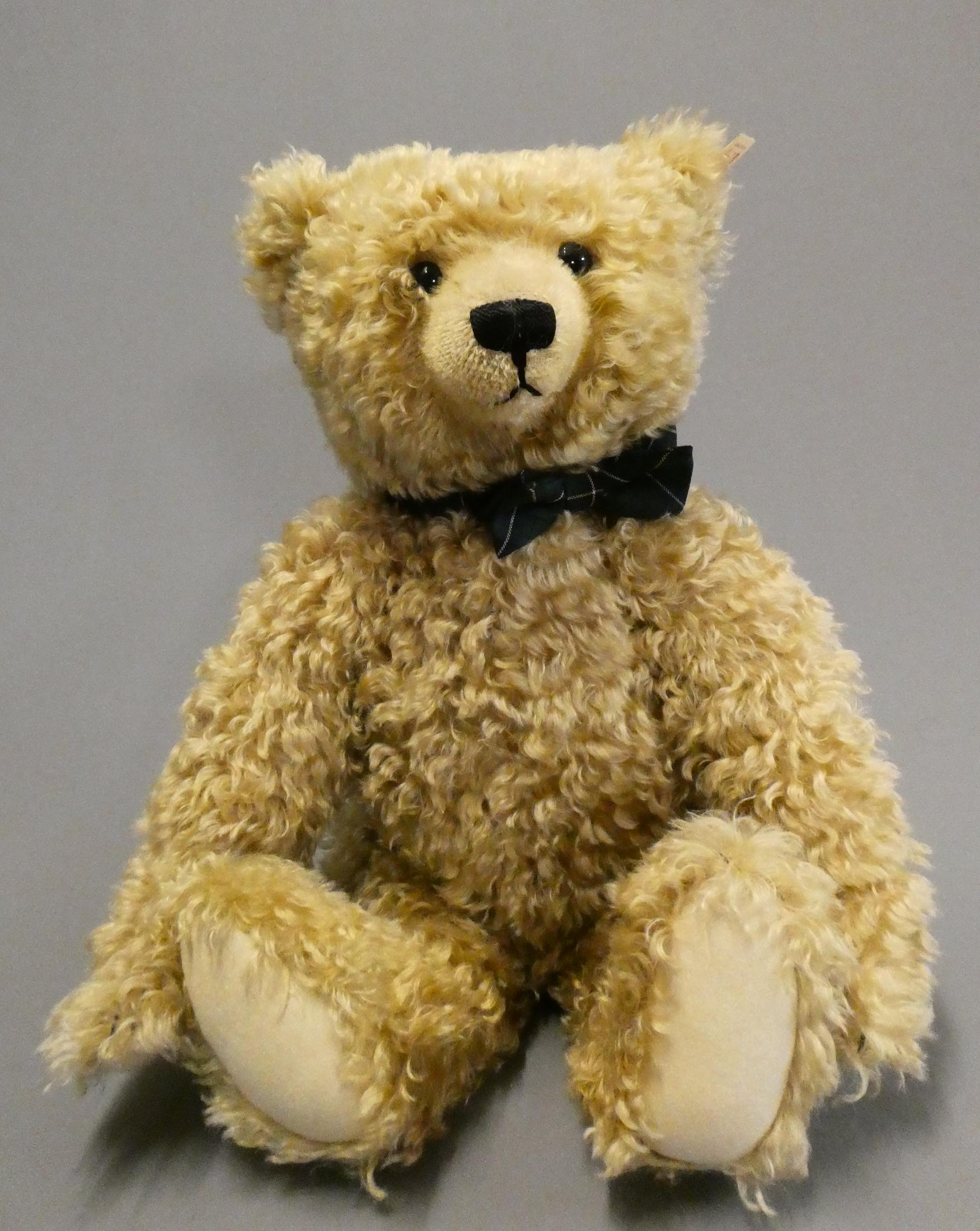 A large Steiff growling teddy bear, with long orange curly plush, sewn nose, all black eyes, felt Image
