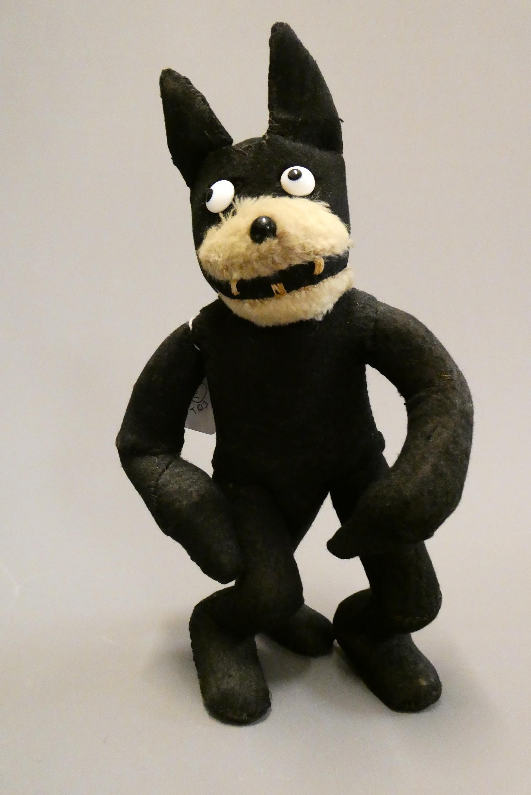 A vintage Felix the Cat, with felt body, sewn teeth, sideways glancing eyes and plush mouth, 12 3/4" Image