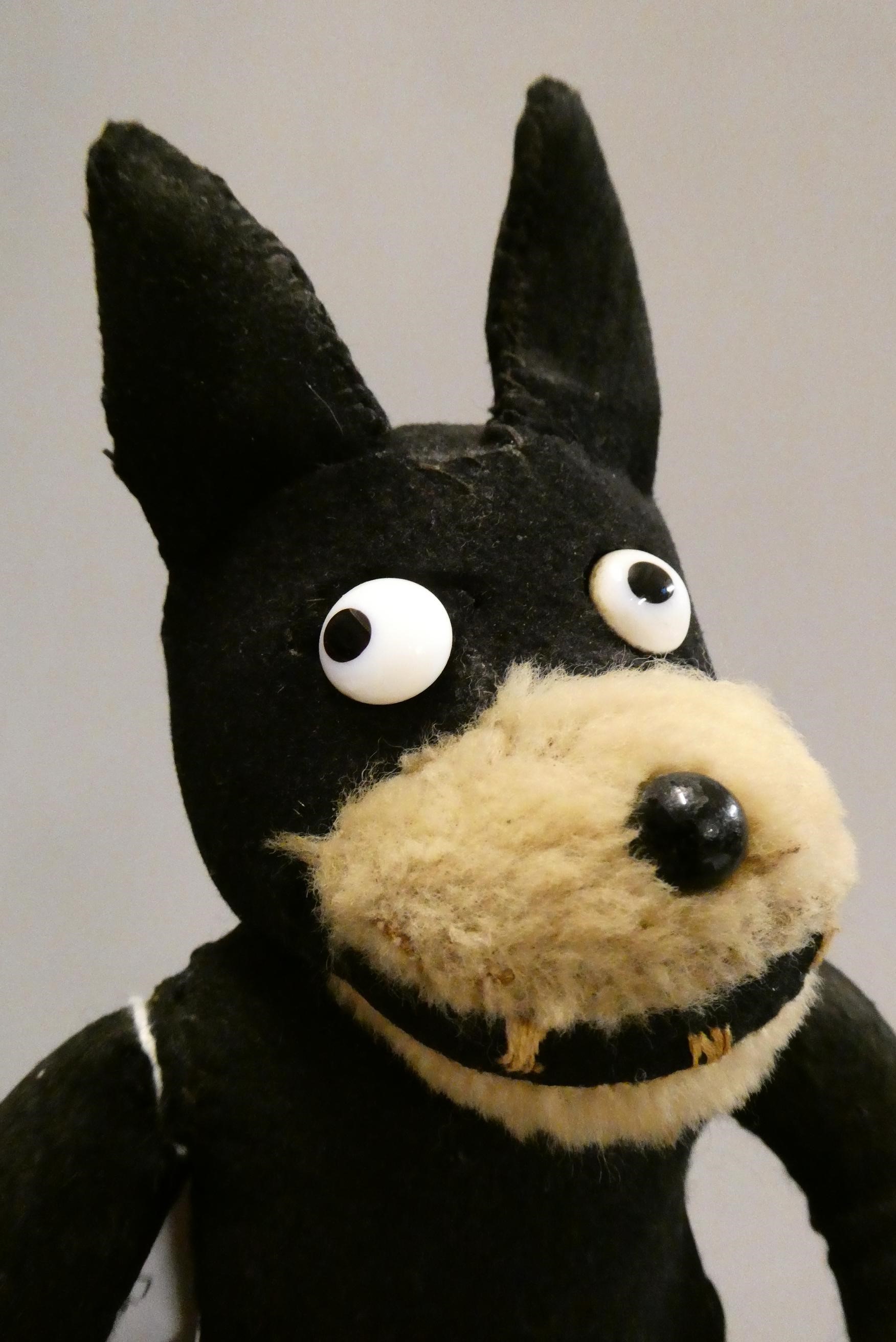 A vintage Felix the Cat, with felt body, sewn teeth, sideways glancing eyes and plush mouth, 12 3/4" Image