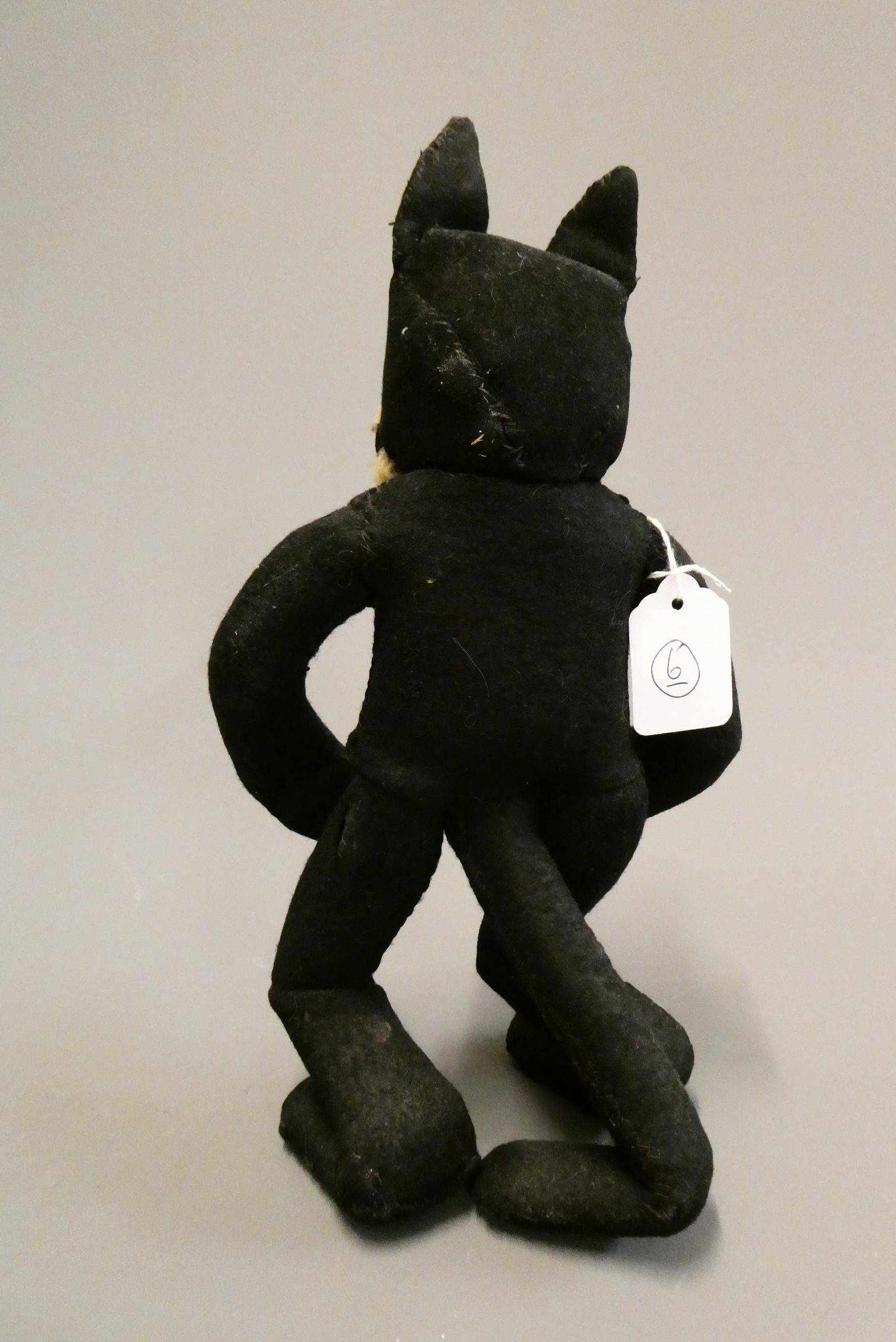 A vintage Felix the Cat, with felt body, sewn teeth, sideways glancing eyes and plush mouth, 12 3/4" Image