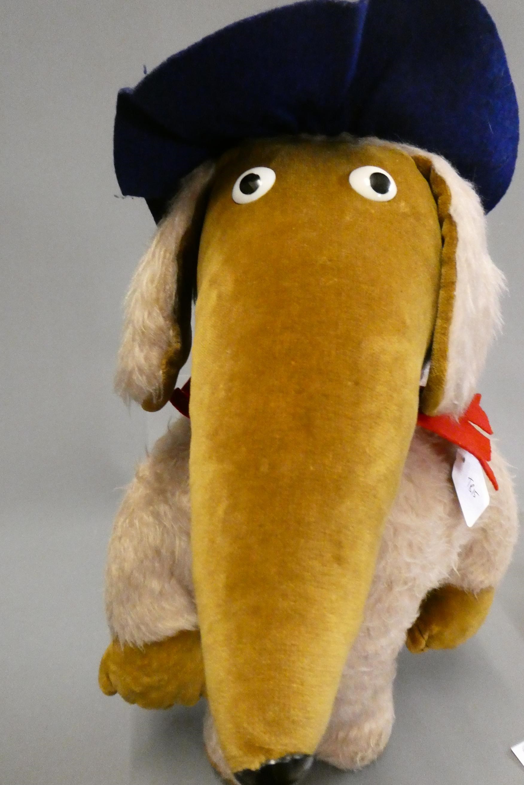 A vintage Womble, with plastic nose and eyes, light plush body, brown velvet face, ears and pads, Image